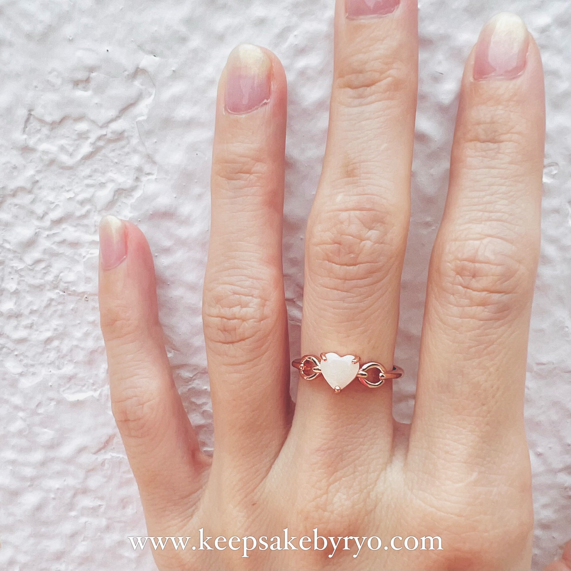 SOLITAIRE: HOPE HEARTLINKS RING WITH HEART SHAPED INCLUSION STONE