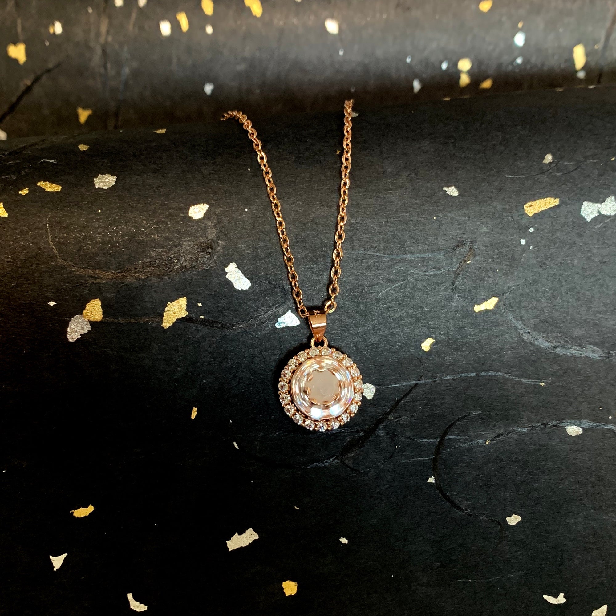 SOLITAIRE: WHEEL OF FORTUNE SPINNING NECKLACE WITH ROUND INCLUSION STONE
