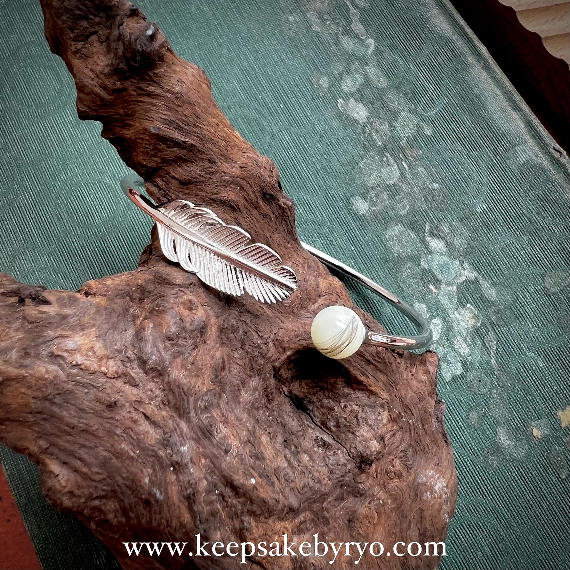 INCLUSION PEARL BANGLE WITH FEATHER DETAIL