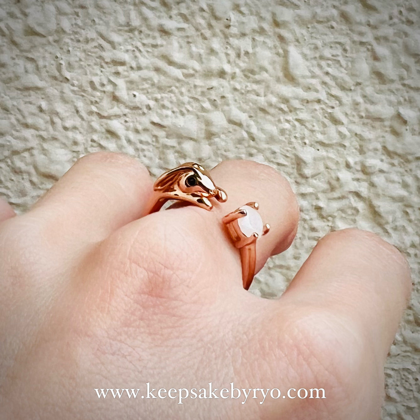 SOLITAIRE: BUNNY RING WITH ROUND SHAPED SOLITAIRE
