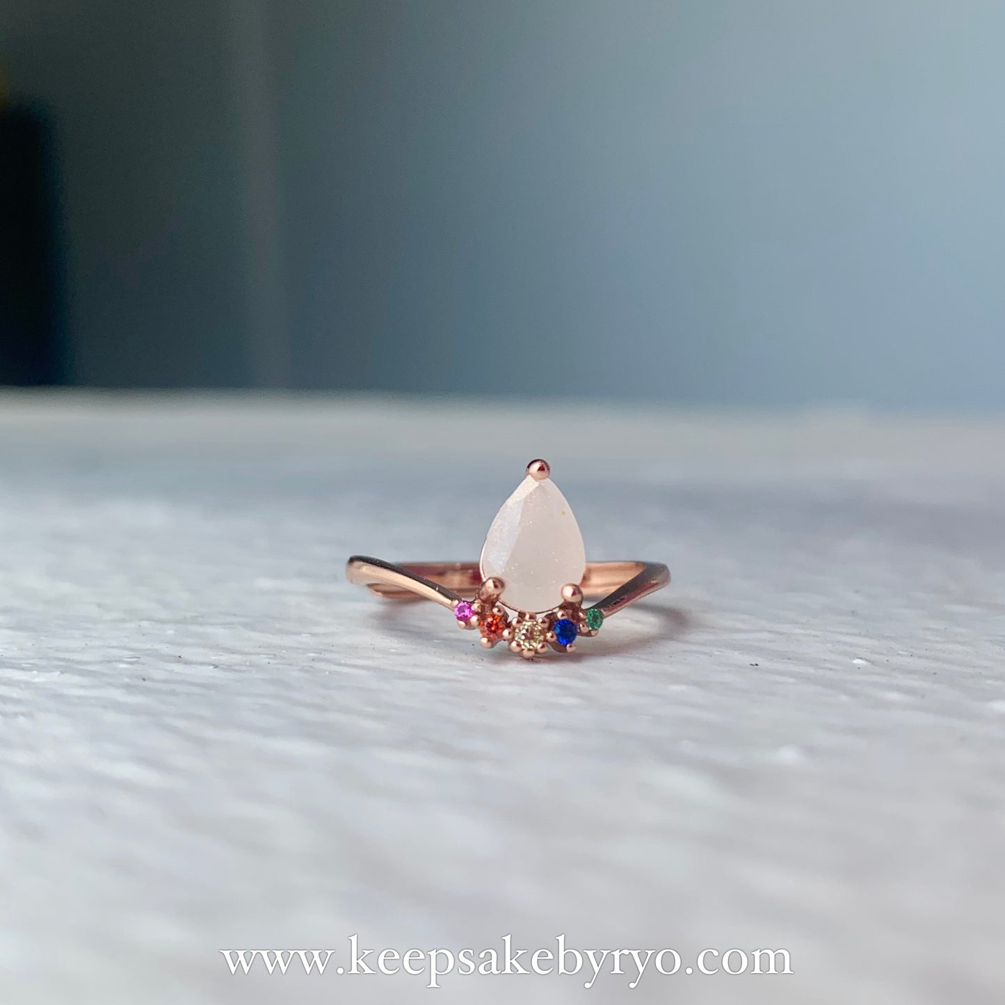 SOLITAIRE: COVA RAINBOW DROP WITH TEARDROP INCLUSION RING