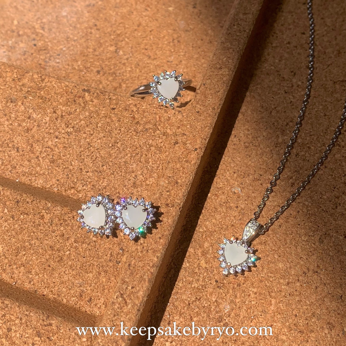 SOLITAIRE: AURORA EAR STUDS WITH HEART SHAPED SOLITAIRE