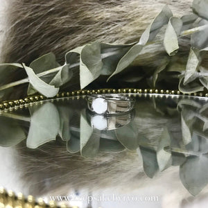 SOLITAIRE: WIDE BAND RING WITH BREASTMILK STONE
