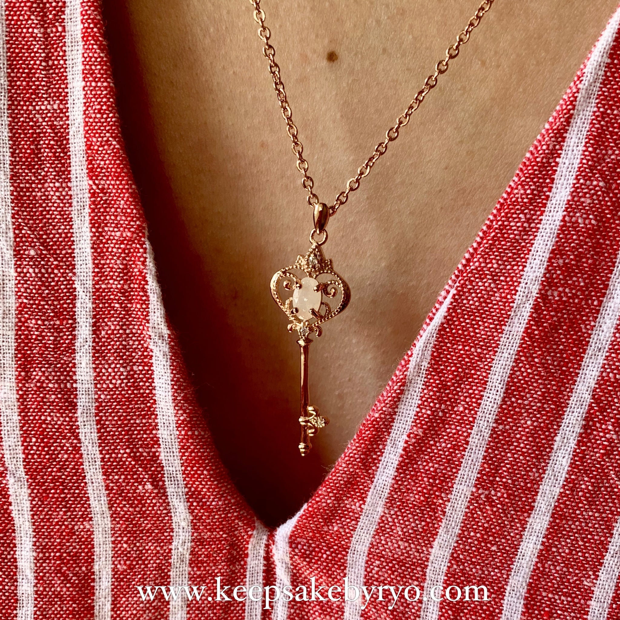 Gold heart sales key pendant
