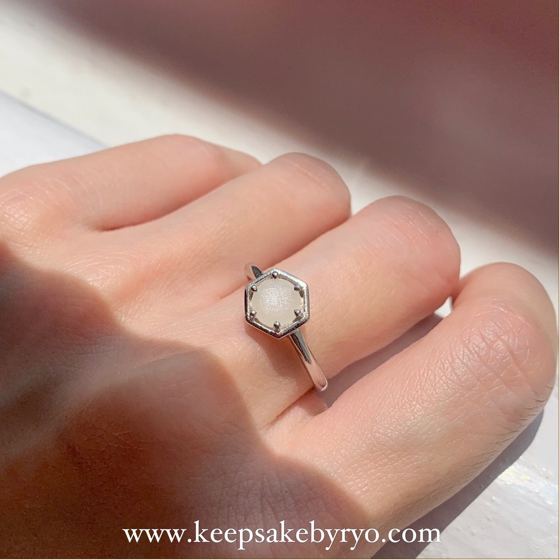 SOLITAIRE: HEXI RING WITH ROUND INCLUSION STONE