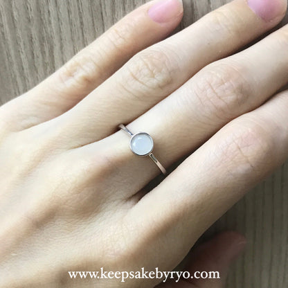 SOLITAIRE: BEZEL RING WITH ROUND INCLUSION STONE