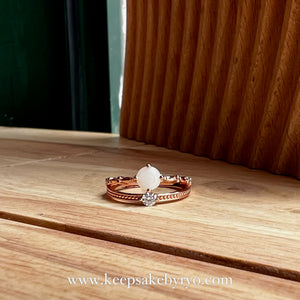SOLITAIRE: ELLIS TIARA RING WITH ROUND INCLUSION STONE