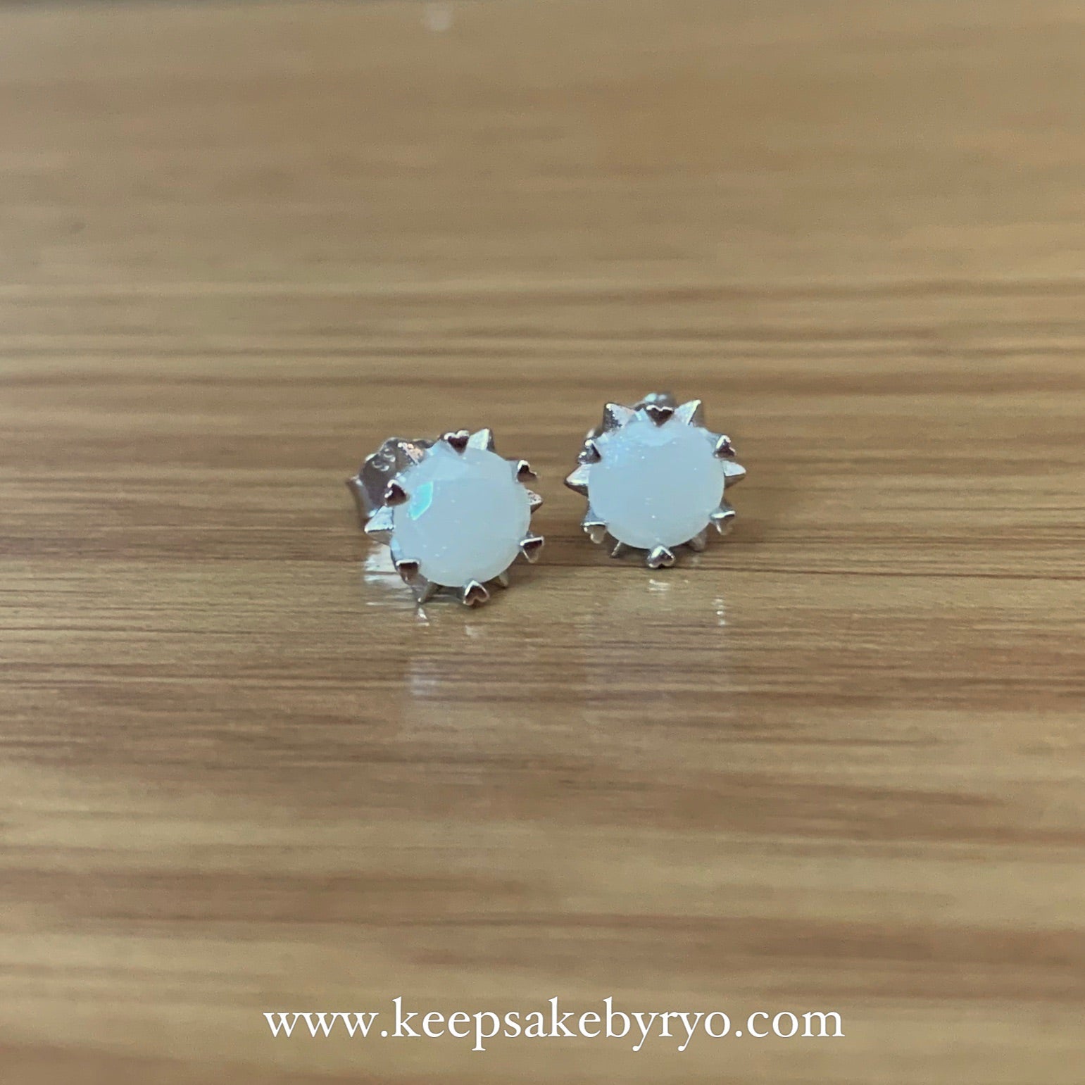 SOLITAIRE: STARBURST HEARTS EAR STUDS WITH ROUND INCLUSION STONE